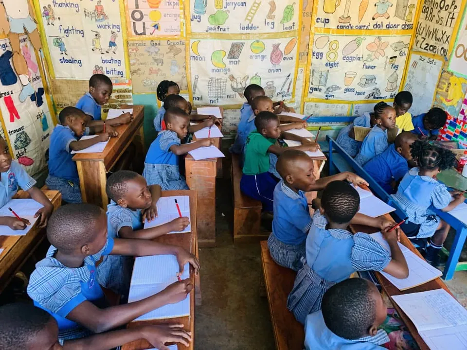 Pupils learning inside a classroom at Alpha Kindergarten and Primary School