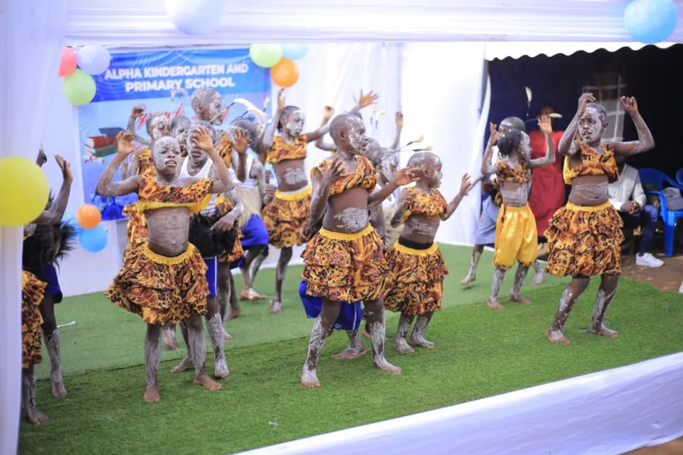 Children performing together on a decorated stage.
